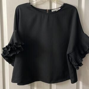 Black Dolmain sleeve ruffle sleeve blouse w/gold exposed hardware zipper Size M